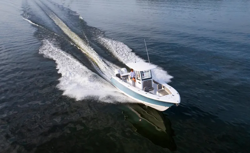 Slide: The Image of 2025 Sea Hunt Gamefish 27 speeding on open water, showcasing sleek design and performance. - 7