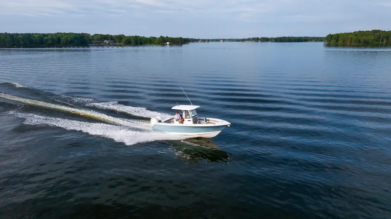 Slide: The Image of 2025 Sea Hunt Gamefish 27 cruising on a serene lake. - 8