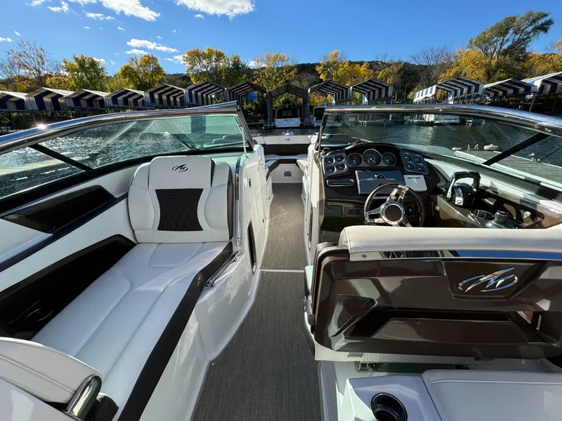Slide: The Image of 2018 Monterey 328 Super Sport boat interior with luxurious seating and modern dashboard. - 16
