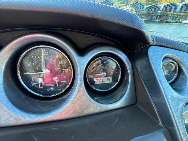 Slide: The Image of Dashboard of a 2018 Monterey 328 Super Sport boat with speedometer and gauges. - 21