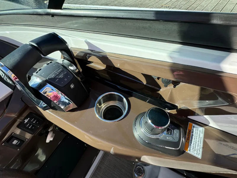 Slide: The Image of Dashboard of a 2018 Monterey 328 Super Sport boat with steering wheel and controls. - 22