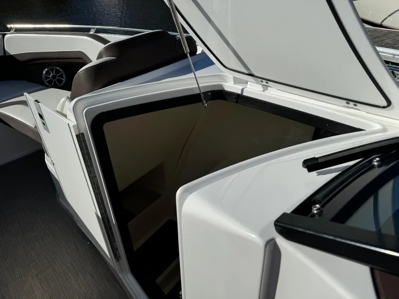 Slide: The Image of 2018 Monterey 328 Super Sport boat interior with open storage compartment. - 25