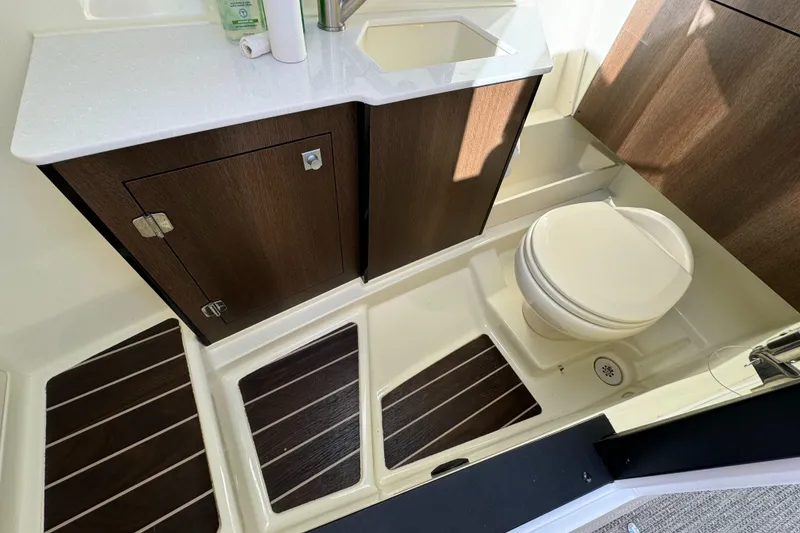 Slide: The Image of 2018 Monterey 328 Super Sport bathroom with modern fixtures and wood accents. - 27
