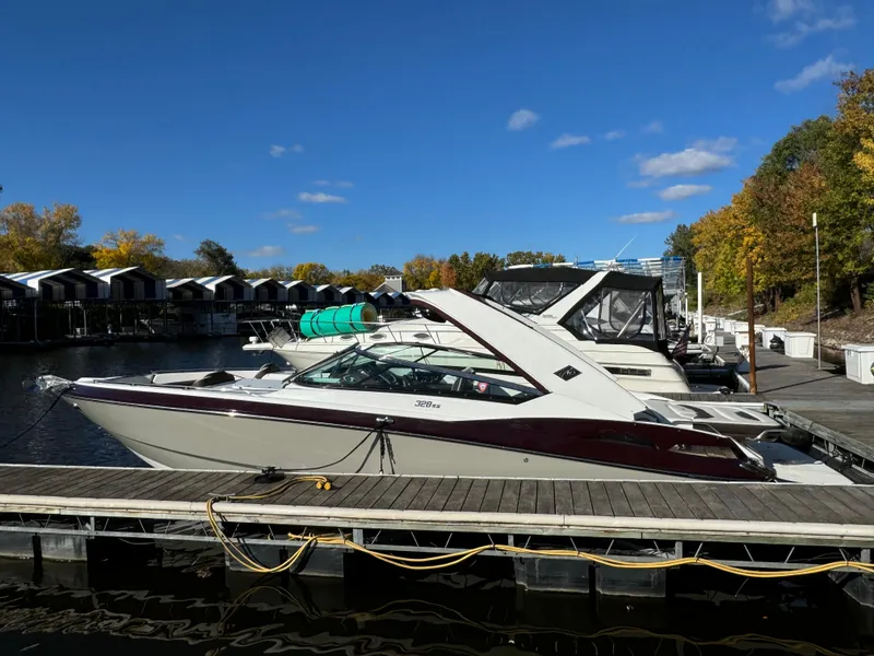 Slide: The Image of 2018 Monterey 328 Super Sport boat docked at marina under clear blue sky. - 3