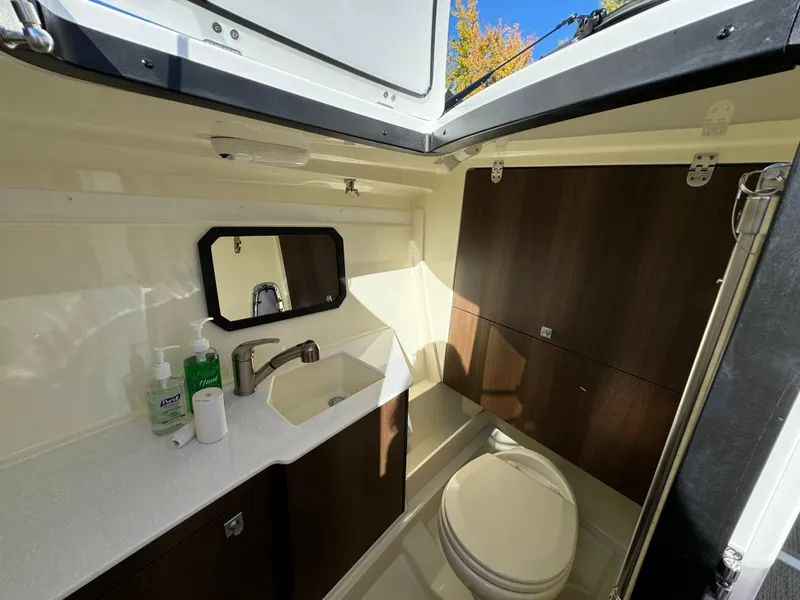 Slide: The Image of 2018 Monterey 328 Super Sport boat bathroom with sink, mirror, and toilet. - 30