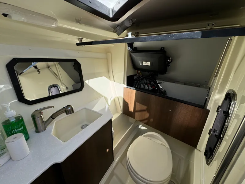 Slide: The Image of 2018 Monterey 328 Super Sport boat bathroom with sink, mirror, and toilet. - 31