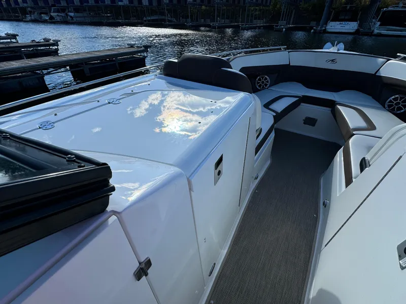 Slide: The Image of 2018 Monterey 328 Super Sport boat interior with sleek seating and waterfront view. - 32