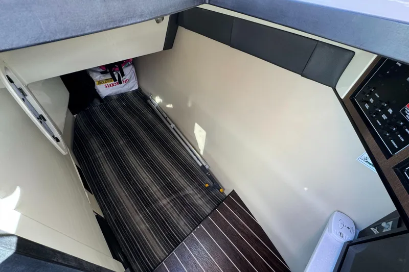 Slide: The Image of Interior cabin of 2018 Monterey 328 Super Sport boat with striped flooring. - 36