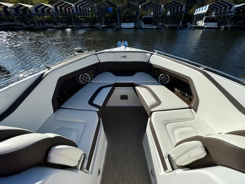 Slide: The Image of 2018 Monterey 328 Super Sport boat interior with luxurious seating and waterfront view. - 39