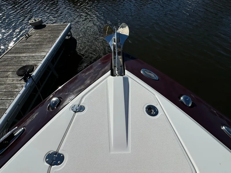 Slide: The Image of Bow of 2018 Monterey 328 Super Sport boat docked by the water. - 40