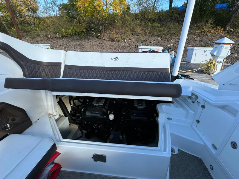 Slide: The Image of 2018 Monterey 328 Super Sport boat engine compartment with open hatch, dockside view. - 43