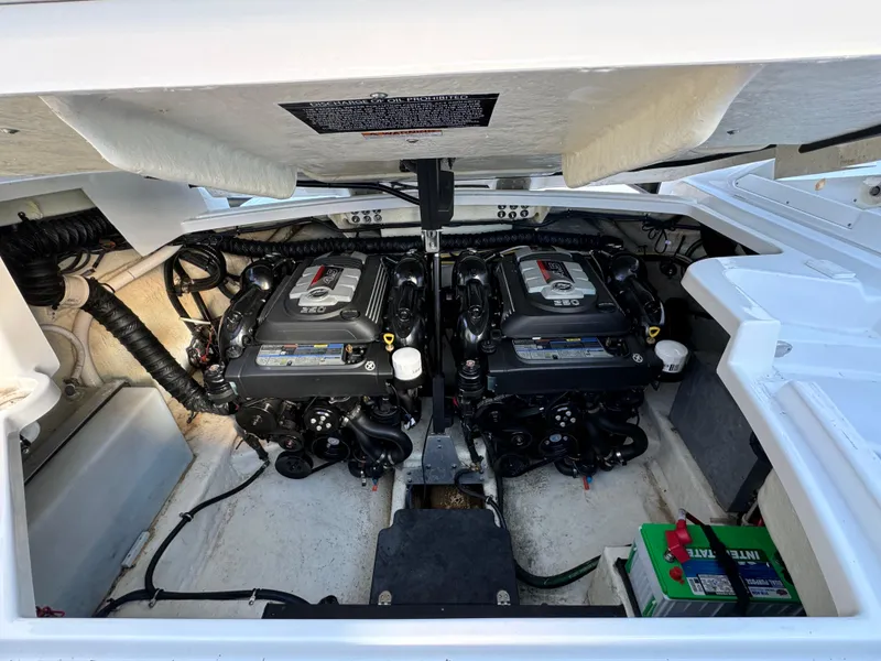 Slide: The Image of Engine compartment of a 2018 Monterey 328 Super Sport boat, featuring dual engines. - 44