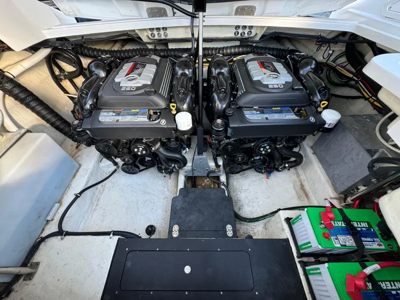 Slide: The Image of Engine compartment of a 2018 Monterey 328 Super Sport boat with dual engines. - 45