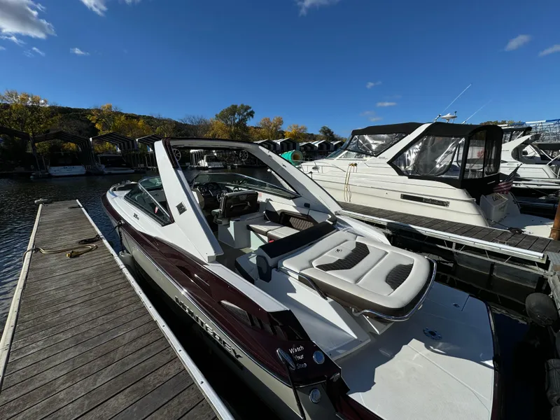 Slide: The Image of 2018 Monterey 328 Super Sport boat docked at marina under clear blue sky. - 5