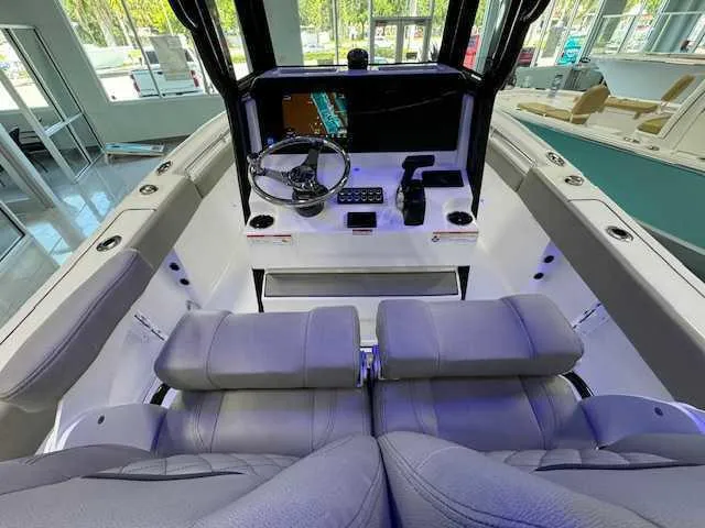 Slide: The Image of 2025 Sportsman Open 212 boat interior with modern helm and seating. - 10