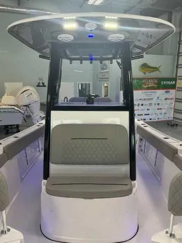 Slide: The Image of 2025 Sportsman Open 212 boat interior with modern seating and overhead lighting. - 26