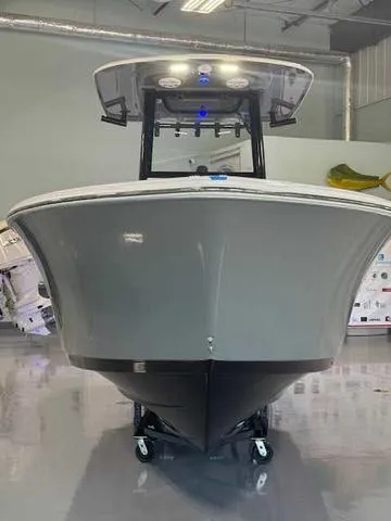 Slide: The Image of 2025 Sportsman Open 212 boat in showroom, front view. - 28