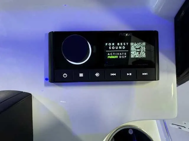 Slide: The Image of Control panel of 2025 Sportsman Open 212 boat with illuminated buttons. - 42