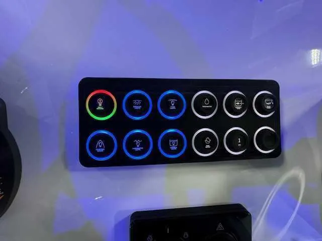 Slide: The Image of Interior of 2025 Sportsman Open 212 boat with Garmin device and blue LED light. - 43