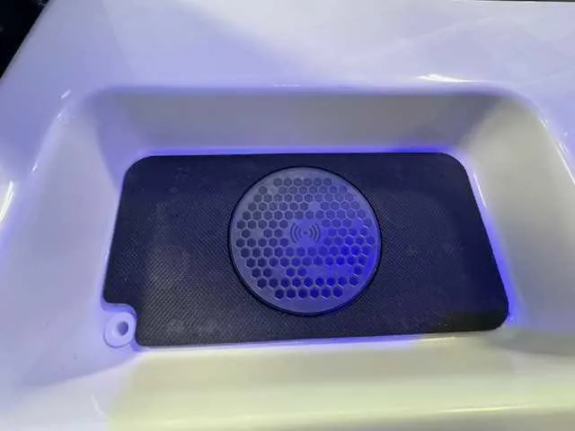 Slide: The Image of 2025 Sportsman Open 212 boat interior with cushioned seating and LED lighting. - 49