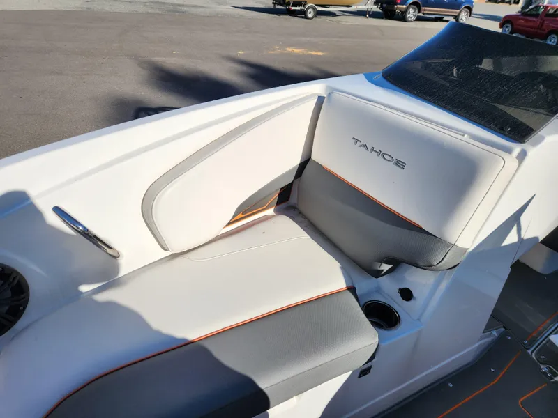 Slide: The Image of 2021 Tahoe 210 S boat interior with gray and white seating. - 14