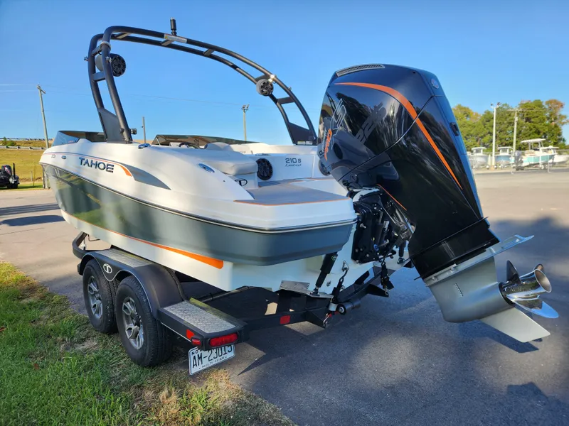 Slide: The Image of 2021 Tahoe 210 S boat on trailer with powerful outboard motor. - 4