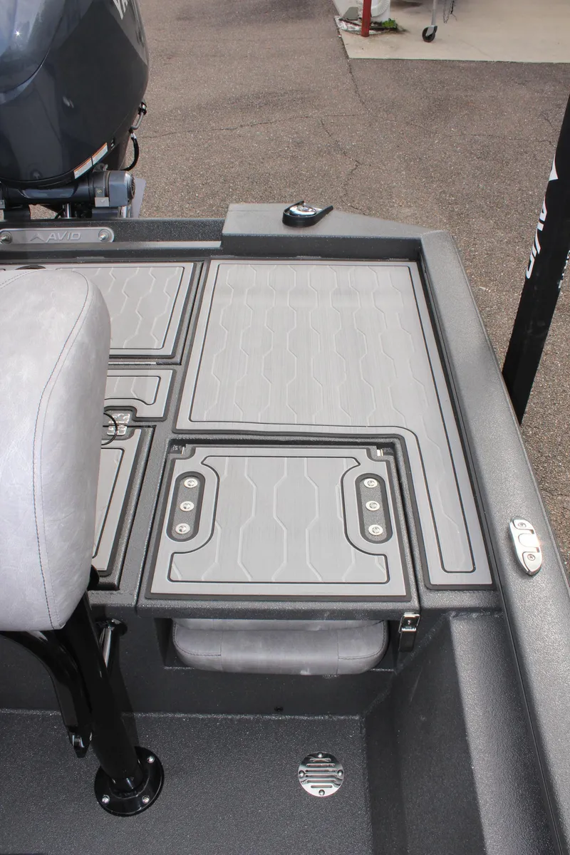 Slide: The Image of 2025 Avid 21 FSX boat deck with storage compartments and seating. - 10