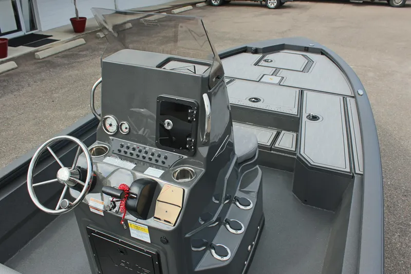 Slide: The Image of 2025 Avid 21 FSX boat interior with steering console and storage compartments. - 17