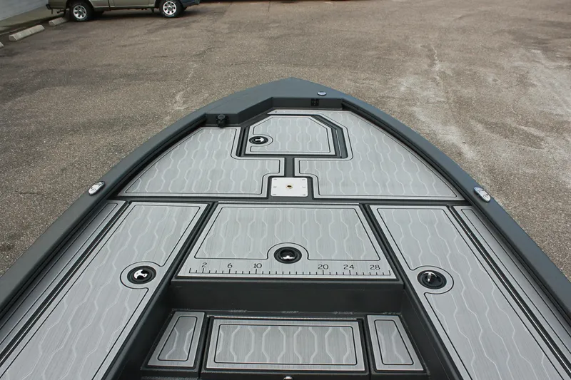 Slide: The Image of 2025 Avid 21 FSX boat deck with sleek, modern design and storage compartments. - 22