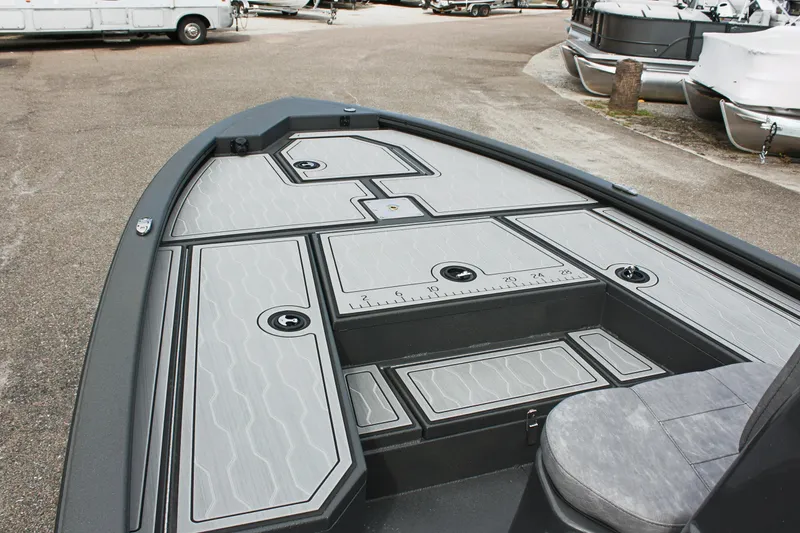 Slide: The Image of 2025 Avid 21 FSX boat deck with storage compartments and seating. - 23