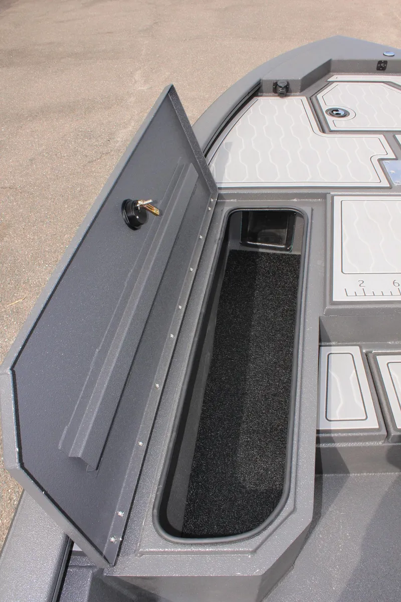 Slide: The Image of 2025 Avid 21 FSX boat storage compartment with open lid, showcasing interior space. - 25