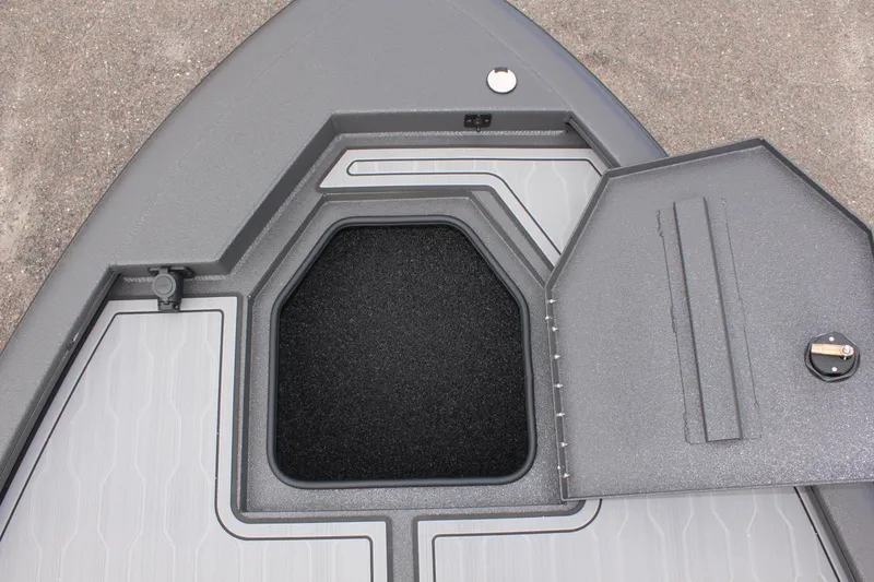 Slide: The Image of 2025 Avid 21 FSX boat storage compartment with open hatch. - 27