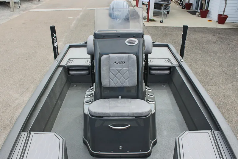 Slide: The Image of 2025 Avid 21 FSX boat interior with central seating and storage compartments. - 28