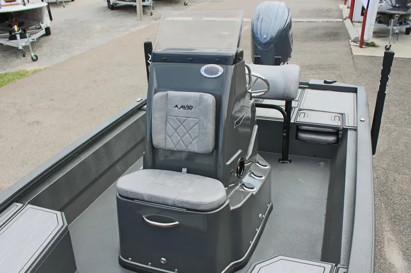 Slide: The Image of 2025 Avid 21 FSX boat interior with console and seating. - 29
