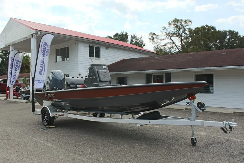 Slide: The Image of 2025 Avid 21 FSX boat on trailer outside dealership. - 3