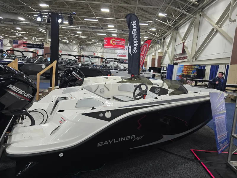 The Image of 2025 Bayliner M17 boat displayed at a trade show. - 0