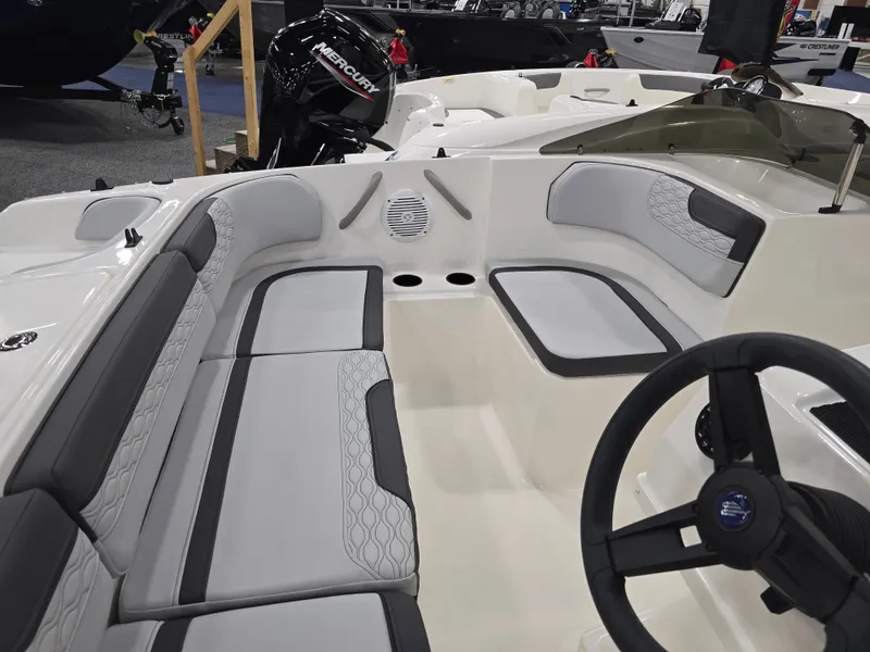 Slide: The Image of Interior of 2025 Bayliner M17 with gray upholstery and steering wheel. - 12