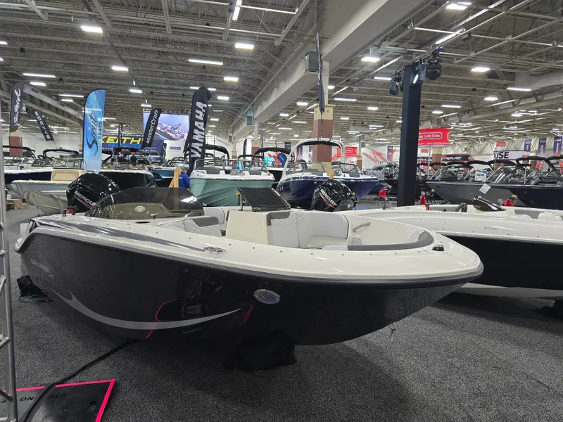 Slide: The Image of 2025 Bayliner M17 boat displayed at a trade show. - 4