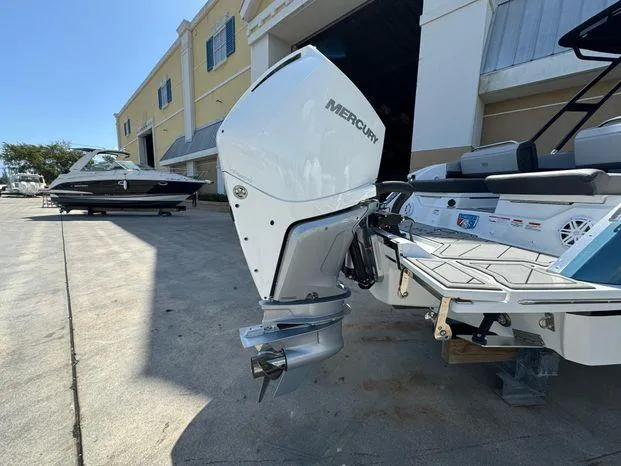Slide: The Image of 2023 Cobalt R8 Outboard with Mercury engine, parked outside a building. - 12