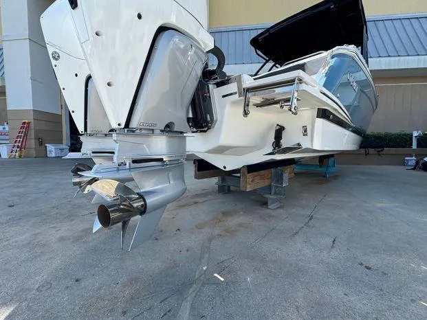 Slide: The Image of 2023 Cobalt R8 Outboard boat on display, showcasing powerful engine and sleek design. - 13