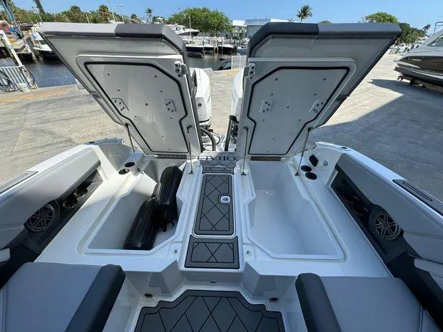Slide: The Image of 2023 Cobalt R8 Outboard boat with open storage compartments at the dock. - 41