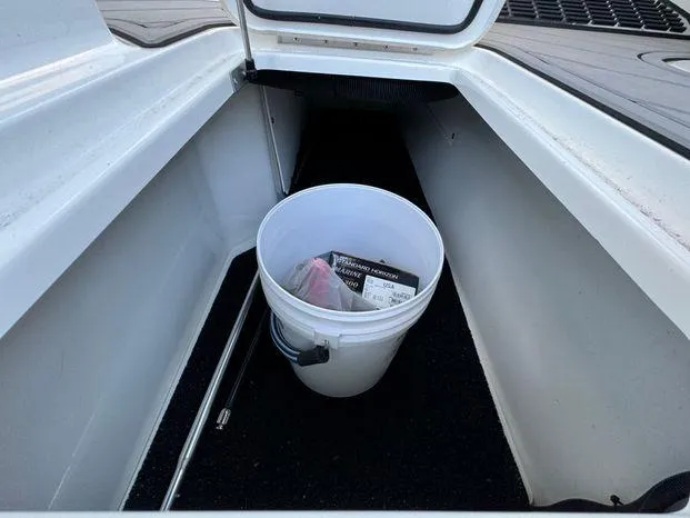Slide: The Image of 2023 Cobalt R8 Outboard storage compartment with bucket and accessories. - 48