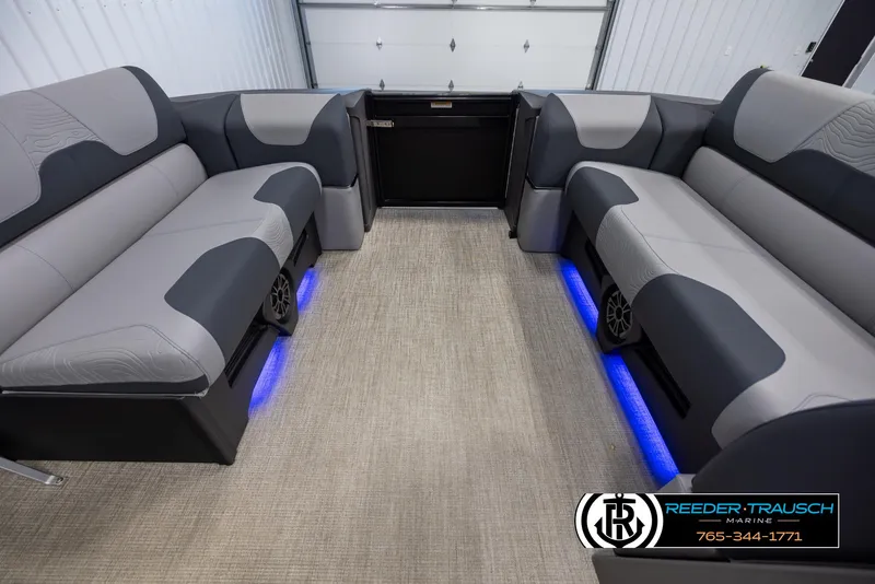 Slide: The Image of Interior of 2025 Tahoe TGO RF boat with gray seating and blue LED lighting. - 18