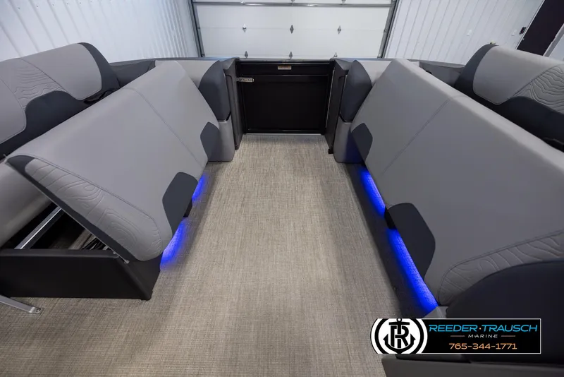 Slide: The Image of 2025 Tahoe TGO RF interior with gray seating, blue LED lighting, and carpeted flooring. - 19