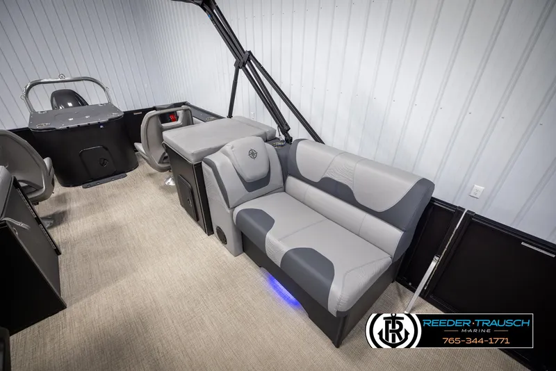 Slide: The Image of 2025 Tahoe TGO RF boat interior with gray seating and modern design. - 20
