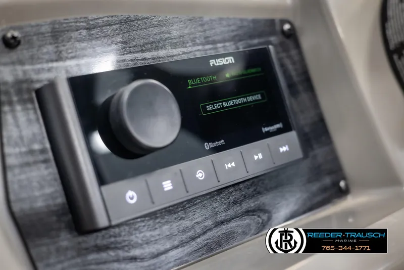 Slide: The Image of 2025 Tahoe TGO RF Bluetooth audio system with control panel and display. - 27