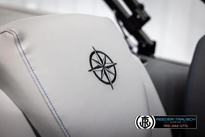 Slide: The Image of White seat with compass embroidery in a 2025 Tahoe TGO RF boat. - 35