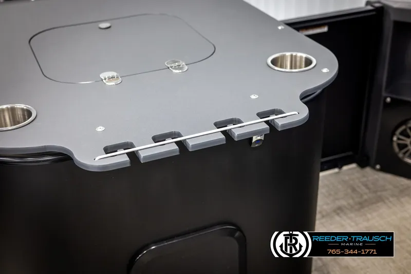 Slide: The Image of 2025 Tahoe TGO RF boat table with cup holders and storage compartment. - 39