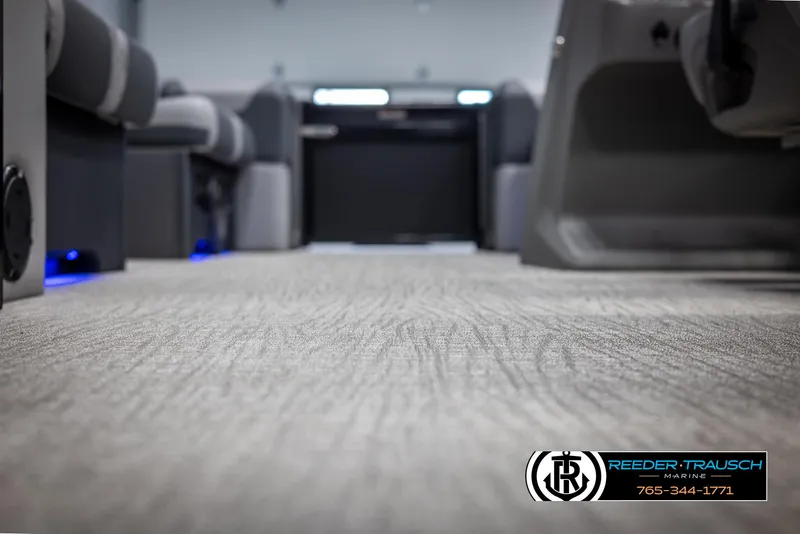 Slide: The Image of Interior view of 2025 Tahoe TGO RF boat with carpeted flooring and seating. - 41