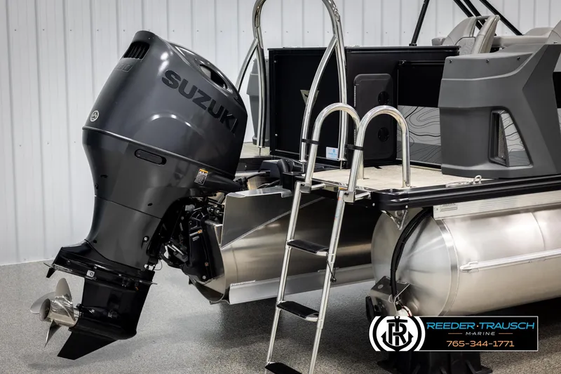 Slide: The Image of 2025 Tahoe TGO RF boat with Suzuki outboard motor and ladder, showcased by Reeder-Trausch Marine. - 42